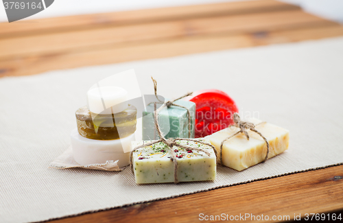 Image of close up of handmade soap bars on wood