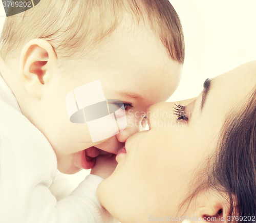 Image of mother kissing her baby