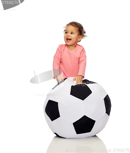 Image of happy mulatto little baby girl playing with ball