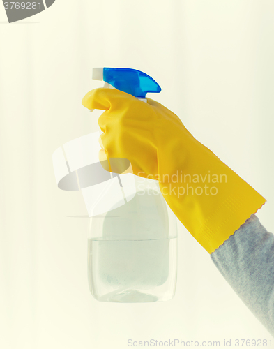 Image of close up of hand with cleanser spraying