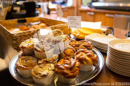 Image of close up of buns and cakes at cafe or bakery