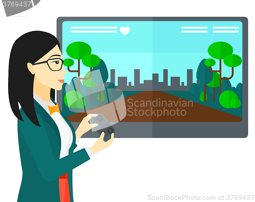Image of Woman playing video game.