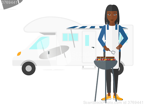 Image of Woman preparing barbecue.