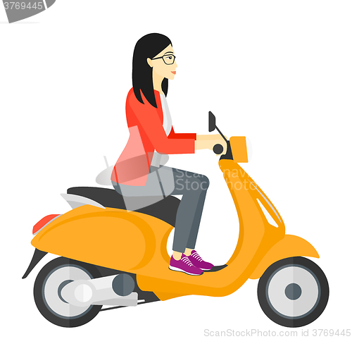 Image of Woman riding scooter.