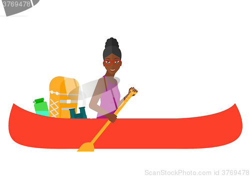 Image of Woman riding in canoe.