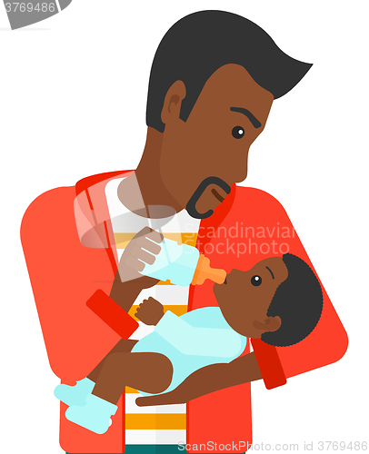 Image of Man feeding baby.