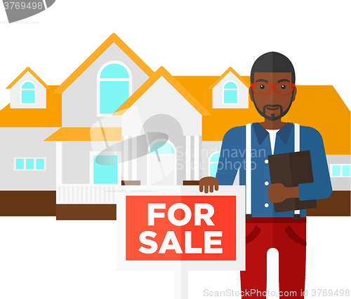 Image of Real estate agent offering house.