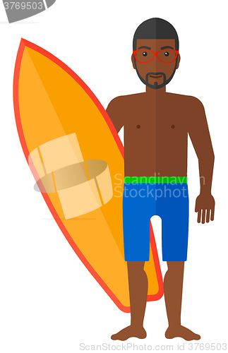 Image of Surfer holding surfboard.