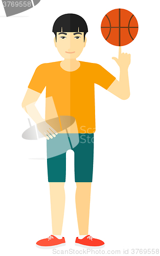 Image of Basketball player spinning ball.