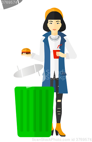 Image of Woman throwing junk food.