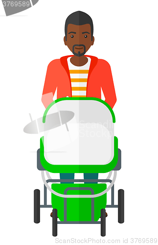 Image of Man pushing pram.