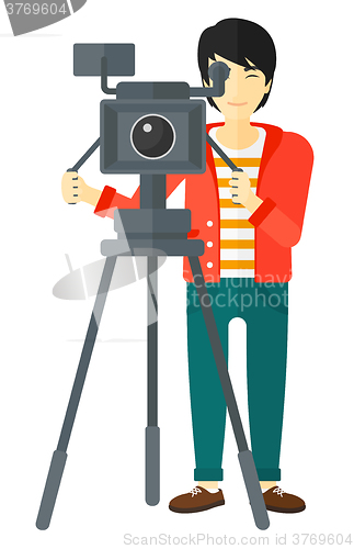Image of Cameraman with movie camera.