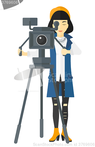 Image of Camerawoman with movie camera.