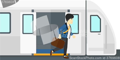 Image of Man going out of train.