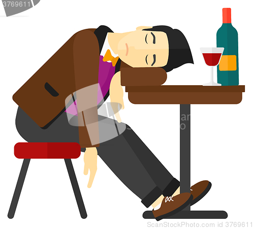 Image of Man sleeping in bar. 