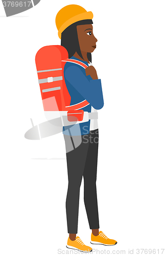 Image of Woman with backpack hiking.