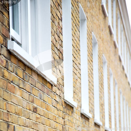 Image of old window in europe london  red brick wall and      historical 