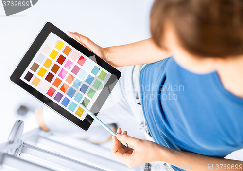 Image of woman working with color samples