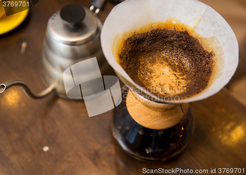 Image of close up of coffeemaker and coffee pot