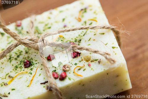 Image of close up of handmade soap bars on wood