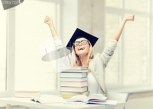 Image of happy student in graduation cap