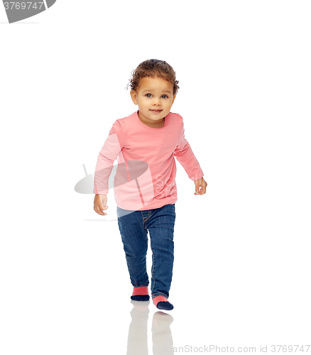 Image of beautiful little baby girl walking