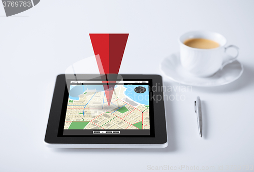 Image of tablet pc with gps navigator map and cup of coffee