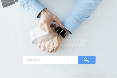 Image of hands with internet browser search on smartwatch