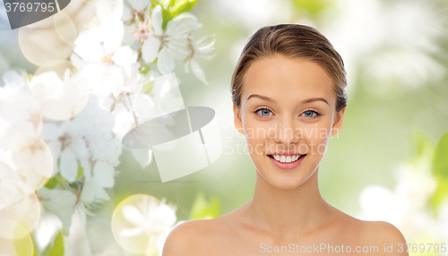 Image of smiling young woman face and shoulders