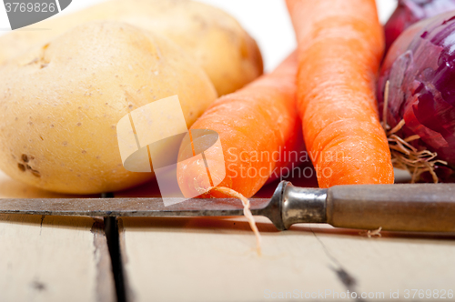 Image of basic vegetable ingredients carrot potato onion 