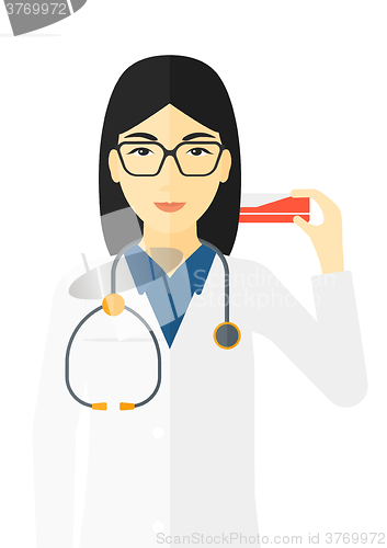 Image of Pharmacist showing some medicine.