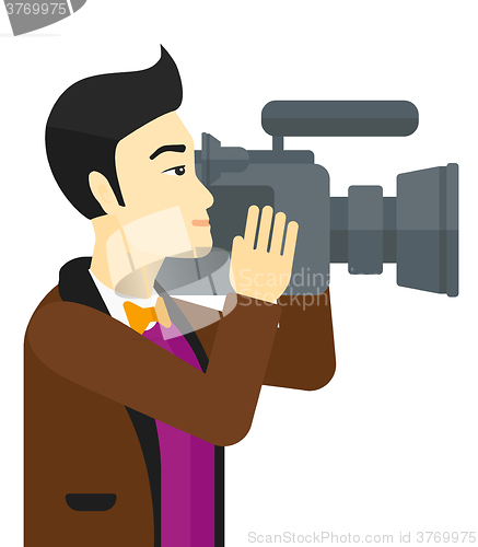 Image of Cameraman with video camera.