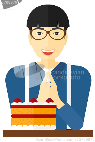 Image of Man looking at cake.