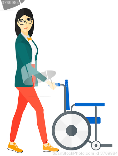 Image of Woman pushing wheelchair.