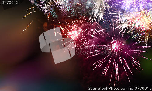 Image of bright sparkling multicolor fireworks