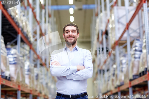 Image of happy man at warehouse