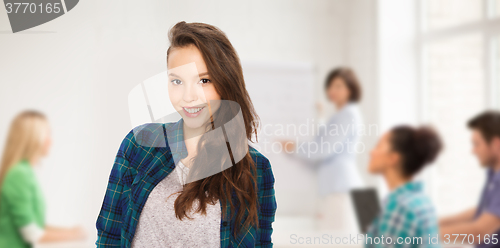 Image of happy teenage student girl at school