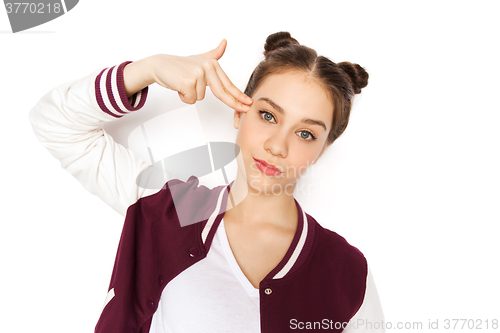 Image of bored teenage girl making finger gun gesture