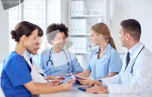 Image of group of happy doctors meeting at hospital office