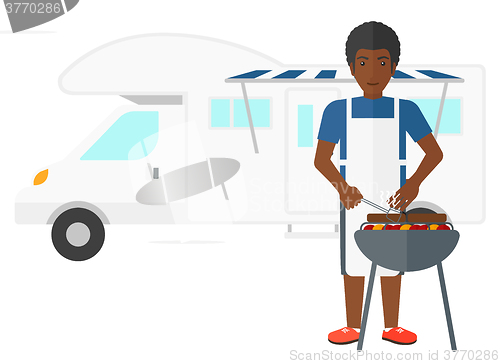 Image of Man preparing barbecue.