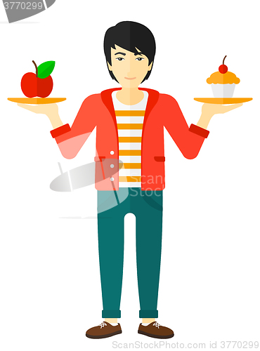 Image of Man with apple and cake.