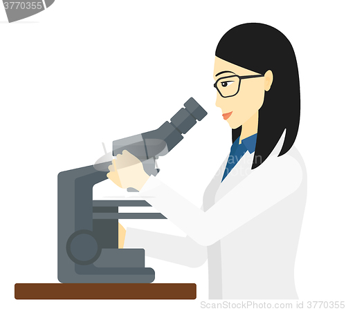 Image of Laboratory assistant with microscope.