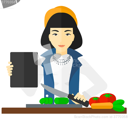 Image of Woman cooking meal.