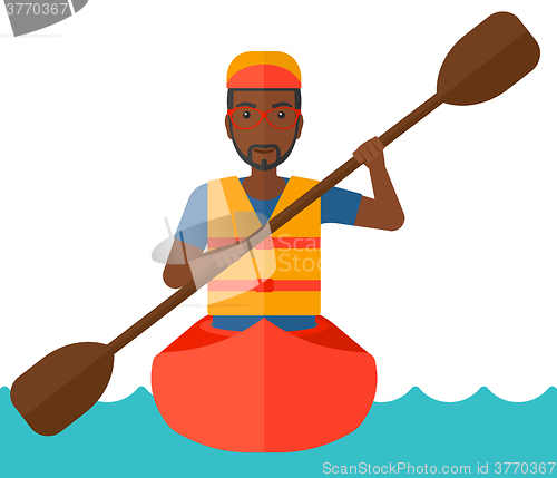 Image of Man riding in canoe.