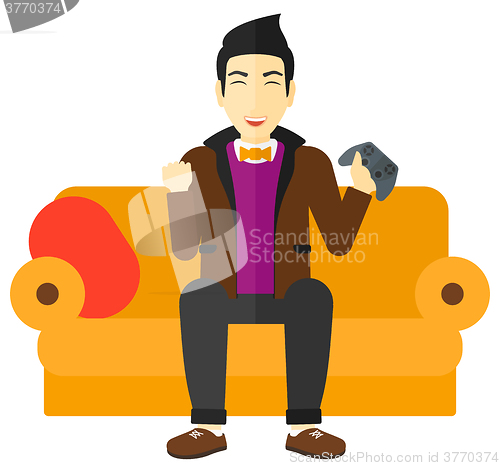 Image of Man playing video game.
