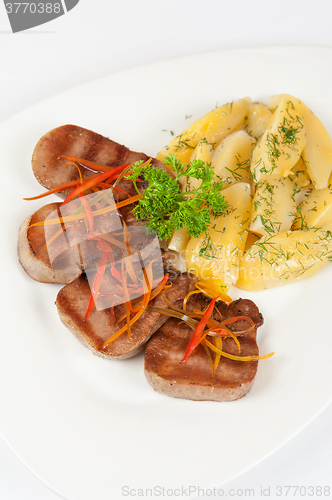 Image of tongue with grilled vegetable