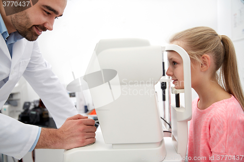 Image of optician with tonometer and patient at eye clinic