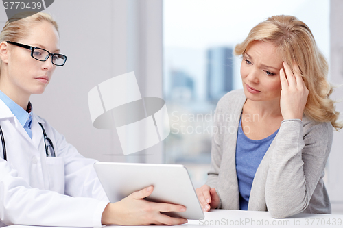 Image of doctor with tablet pc and ill woman at hospital