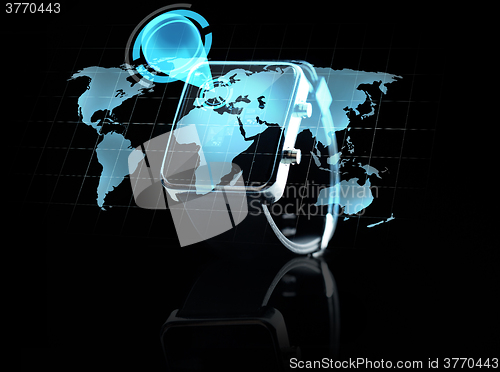 Image of close up of smart watch with world map projection