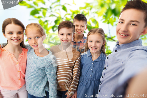 Image of happy children talking selfie